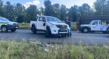 A bakkie involved in an accident on the N2 near Camden Power Station, parked off the roadway.