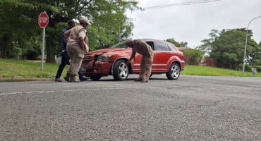 Traffic officers and a motorist at the scene of an accident at the corner of Little and Border Street in Ermelo.
