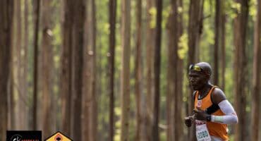 Conquerors Marathon Club runner passing a scenic plantation during the TWK Assegaai 3-in-1 Marathon in Mkhondo.
