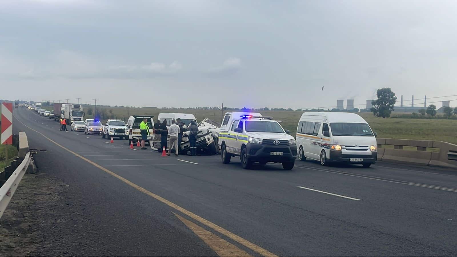 Accident scene on Piet Retief Road with emergency and towing personnel