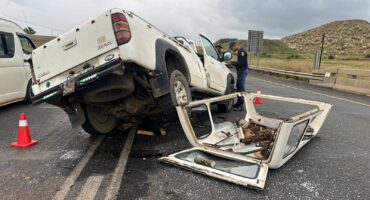 Bakkie damaged after accident with grader on Piet Retief Road