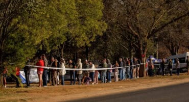 Voters queue outside the Ermelo Sport Inn during the 2024 elections.