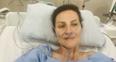 Juliette Basson in a hospital setting during medical treatment.
