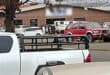 Police vehicles and officials outside a business premises during an immigration compliance operation in Ermelo.