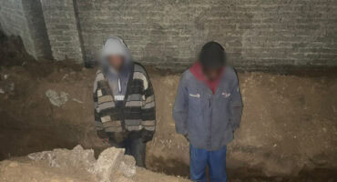 Two suspects with blurred faces following alleged copper cable theft incident.