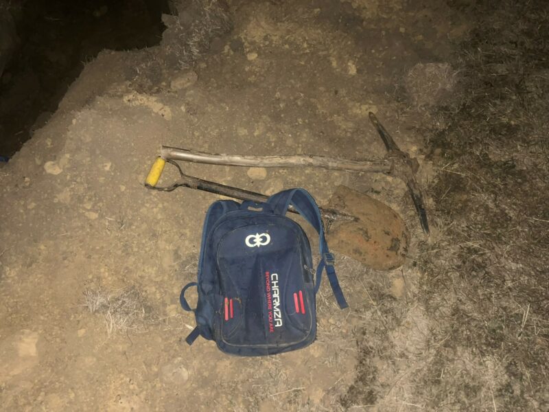 A bag, shovel and pickaxe recovered during the operation.