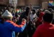 Large crowd of protesters gathered at a central intersection in Ermelo.