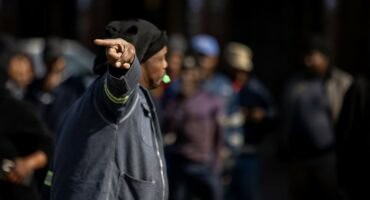 Man gesturing during a public gathering in Ermelo.