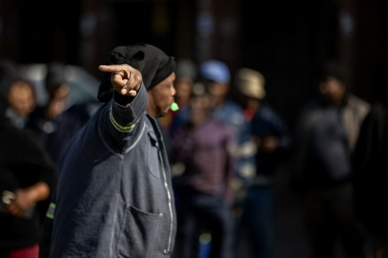 Man gesturing during a public gathering in Ermelo.