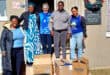Janice Conradie and Hannah Peachey with donated clothing at the CMR Child and Youth Care Centre in Ermelo.