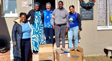 Janice Conradie and Hannah Peachey with donated clothing at the CMR Child and Youth Care Centre in Ermelo.