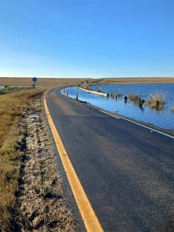 Floodwater overtops the Florence Dam crossing on the Warburton Road near Chrissiesmeer during flooding in April 2025.