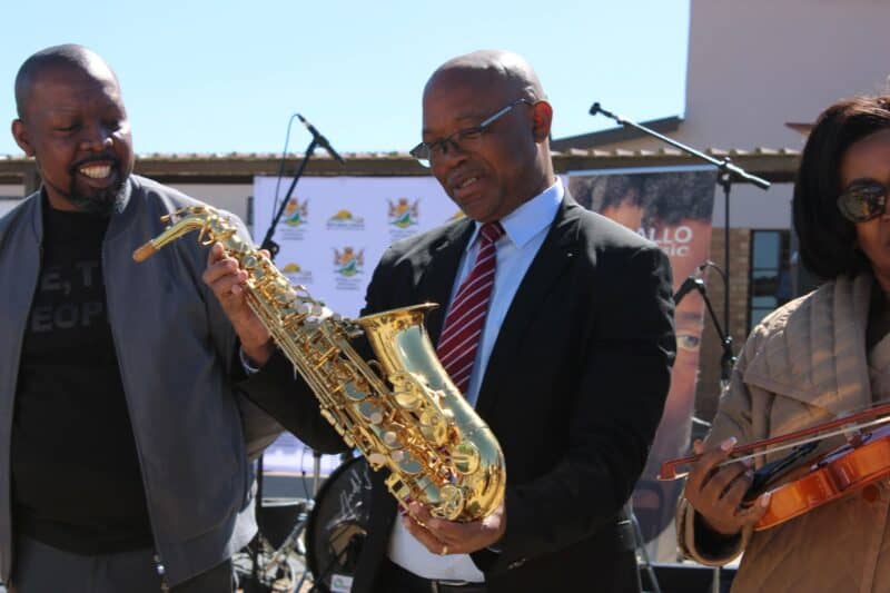 Gert Sibande District Municipality Executive Mayor Walter Mngomezulu examines a saxophone at the Lucky Dube performing arts school in Ermelo