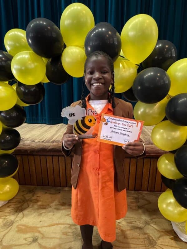 Grade 3 spelling bee champion Boikano Magakwe from Ermelo English Primary School holding her trophy and certificate.
