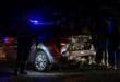 Police and traffic officials stand beside the damaged Msukaligwa Traffic Department vehicle following the collision.
