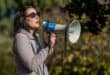 Archive photo of Juliet Basson speaking into a megaphone.