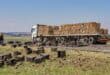 A truck passes on the shoulder as beer bottles, broken glass and crates lie scattered across the Ermelo-Morgenzon road.