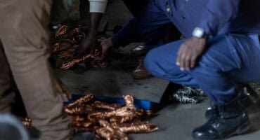 Recovered copper being weighed on an electronic scale during a theft bust