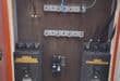 Open electrical cabinet with severed cables and exposed wiring in George Botha Park, Ermelo.