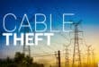 High-mast electricity infrastructure with a cable theft warning illustration.