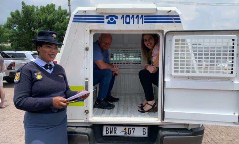 Highvelder editor Wayne van der Walt and Annelize Gouws sit in the back of a police vehicle during a previous SANBS Jail and Bail Blood Drive in Ermelo.
