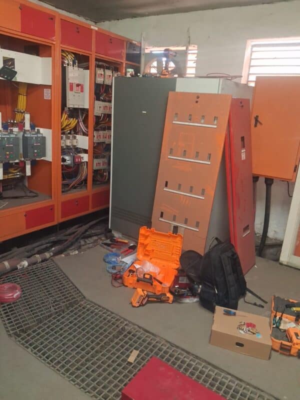 Open electrical distribution panels at Ermelo Provincial Hospital during contractor work.