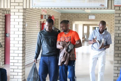 Messrs Henry Mwa and Arinze Nqele leave the court room after their appearance this morning.