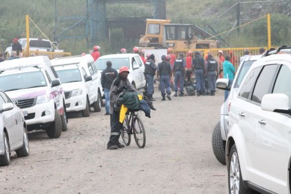 Police and the Red Ants watch and ensure everything is save as squatters leave Secunda dumping site.