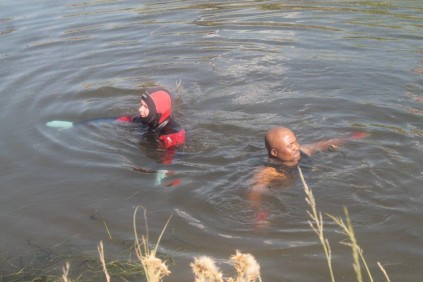 Police divers search for the three men.