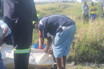 The bodies are being prepared to be taken to the morgue.