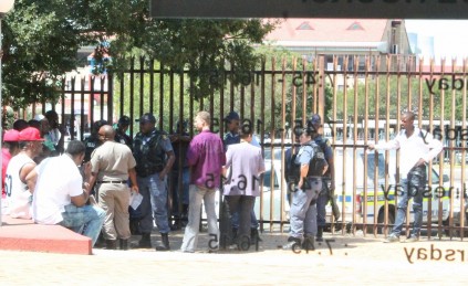 Police search the supporters of the three alleged drug dealers at Secunda Magistrate’s Court and employees of the Immigrations Office check their immigration documents.
