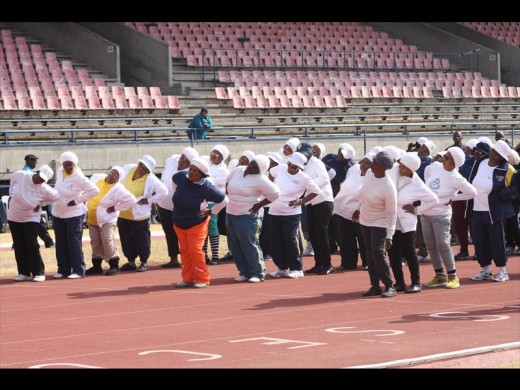 Senior citizens warm up before the activities begin.