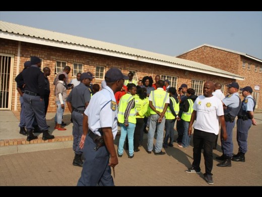W/O Khuselwa Matrose addresses the police after a successful search at the Chief Ampie Mayisa Secondary School.