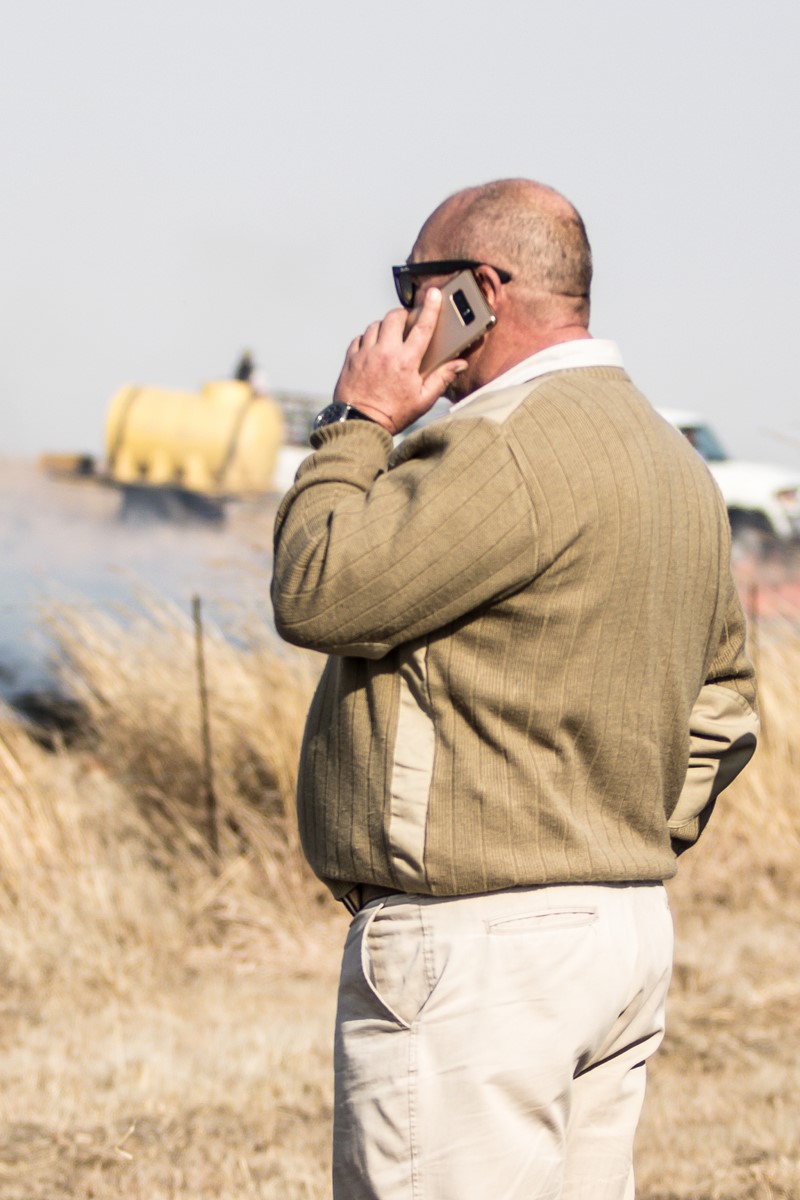 Man wearing a green sweater.