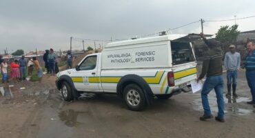 The police 's forensic pathologists arrive on the scene.