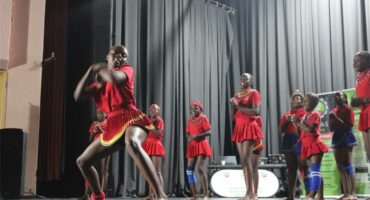 A group of young people in red and blue outfits.