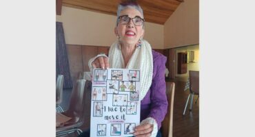 A woman holding up a sign