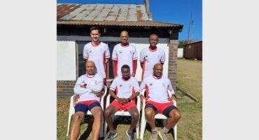 The men's soccer team poses for a photo.