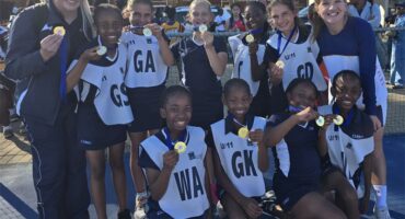 A group of girls with medals and medals.