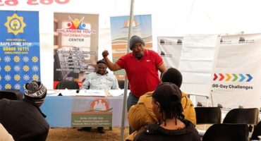 A man giving a presentation at a community event.