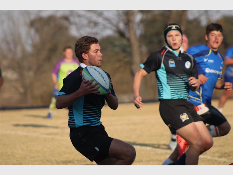 Rugby players in action during a game.