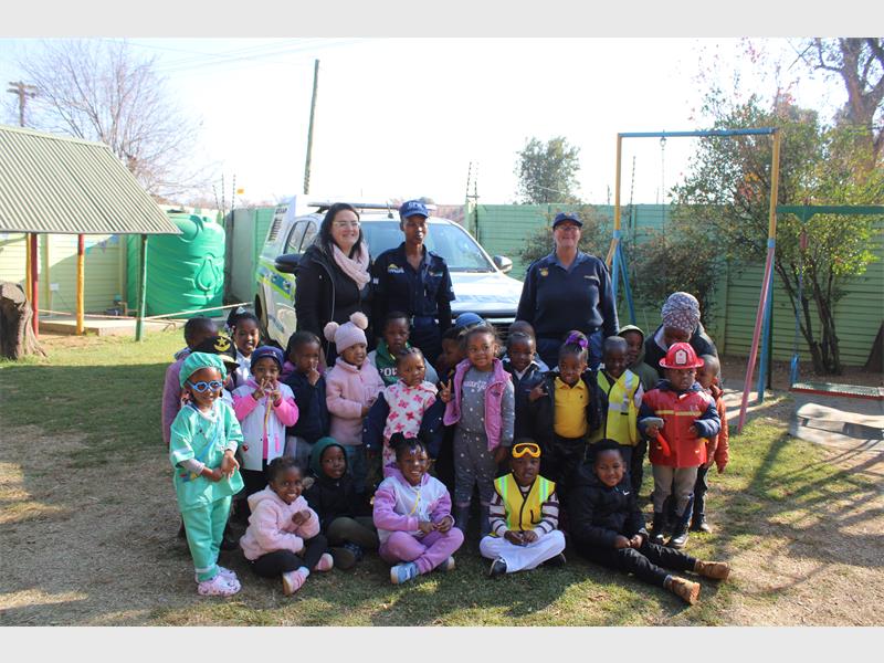 A group of children and adults posing for a photo.