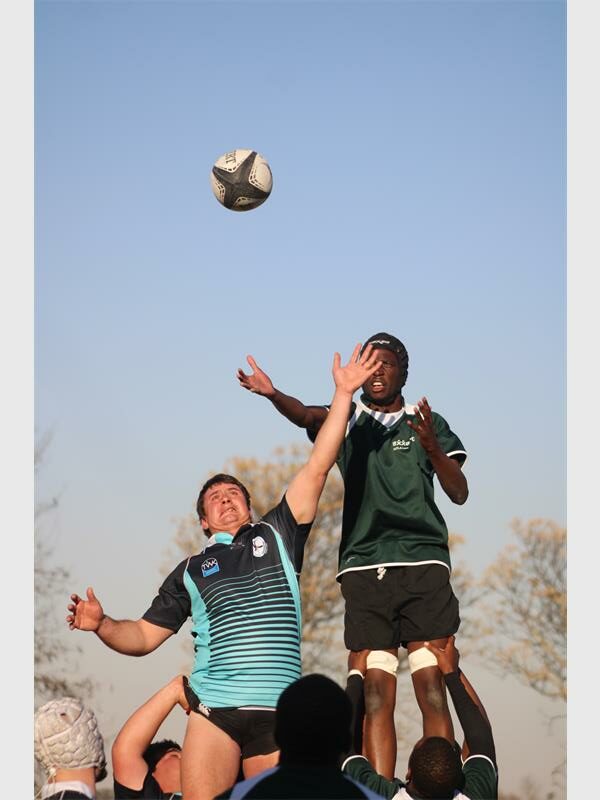 A group of men playing a game of rugby.