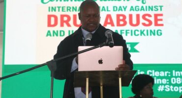 A man giving a speech at a podium.