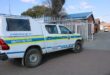 A police truck parked in front of a building.