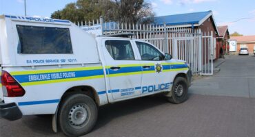 A police truck parked in front of a building.