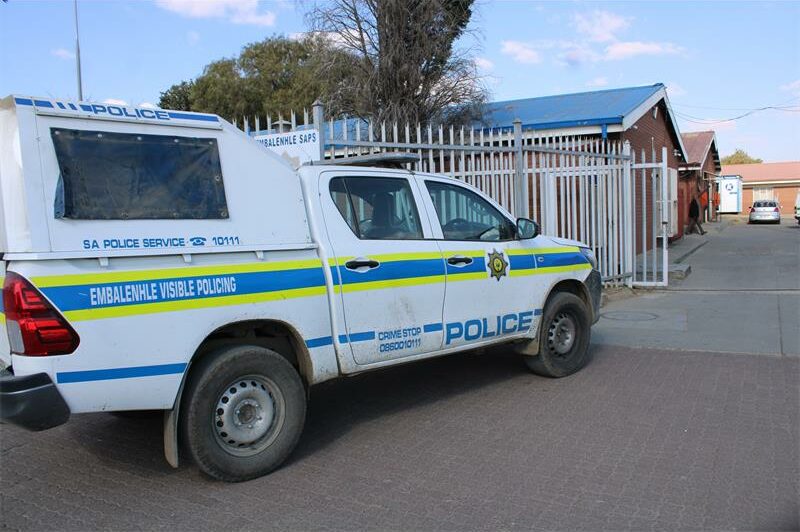 A police truck parked in front of a building.