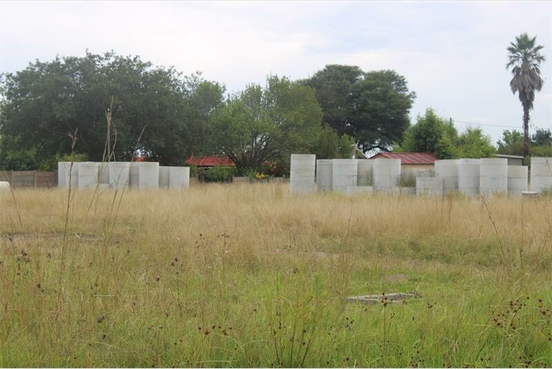 A field with several concrete blocks in it.