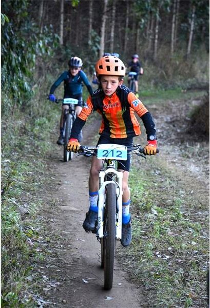 A mountain biker riding down a trail.