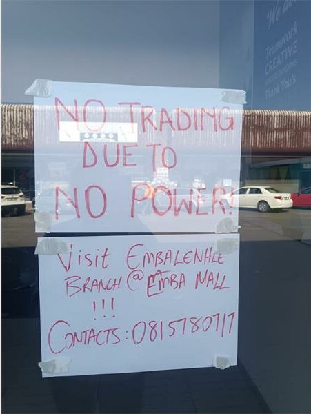 A sign on the door of the new town hall in person says ``no trading due to.